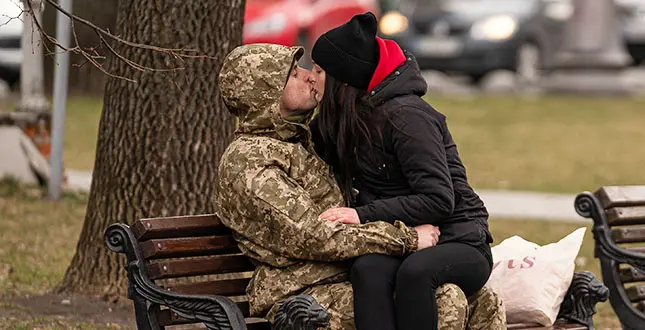 LVIV, UKRAINE - MARCH 03: A Ukrainian man in military dress and a woman kiss, on the eighth day since the beginning of the war in Ukraine, in Lviv (Ukraine). After 8 days of war since the beginning of the attacks in Ukraine by Russia, the balance of the war according to the latest information, both by the Ukrainian government and UNHCR, is at least 2,000 civilians dead and about one million refugees who have fled Ukraine. In the early hours of this eighth day of fighting, Russia has entered a new town of 300,000 inhabitants. Russian and Ukrainian delegations are scheduled to sit down at the negotiating table today. On the table is the demand by the former Soviet republic for a ceasefire and the withdrawal of Russian troops from Ukrainian territory. read less. (Photo By Pau Venteo/Europa Press via Getty Images)